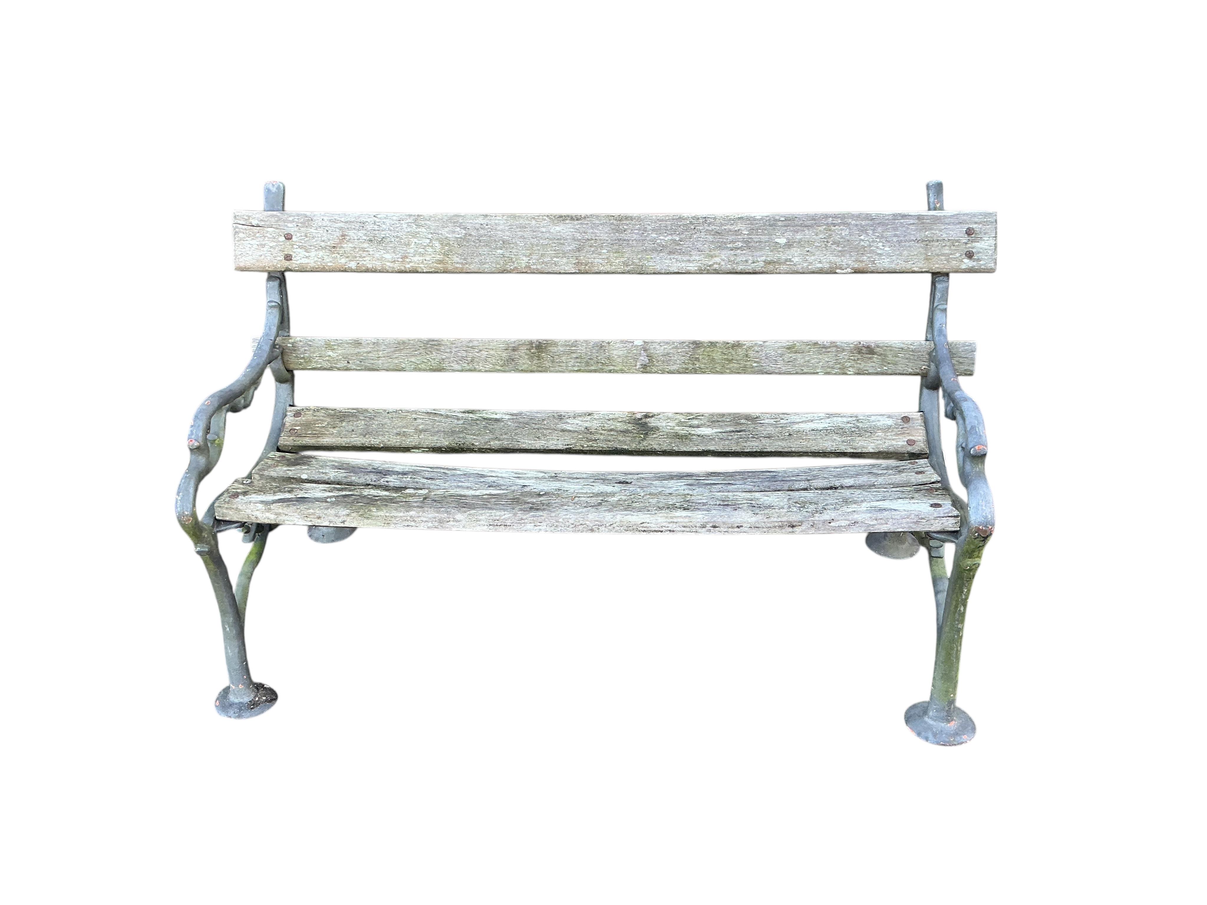 A Coalbrookdale style slatted cast iron garden bench, width 152cm, depth 66cm, height 82cm